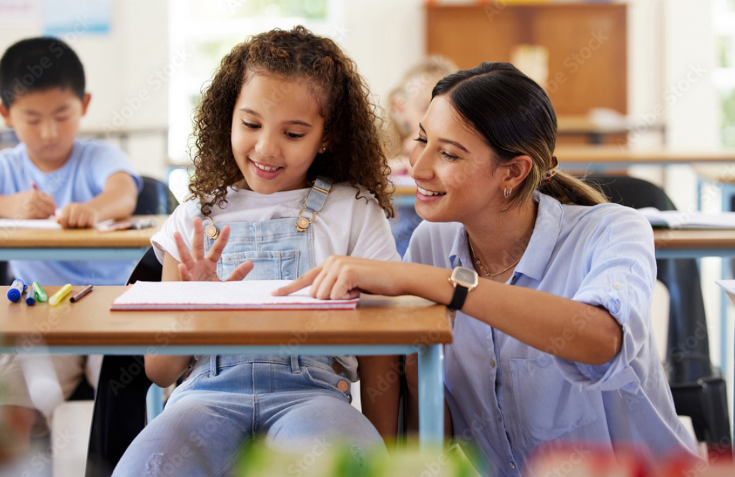 Teacher helping a student at Kings Nova School